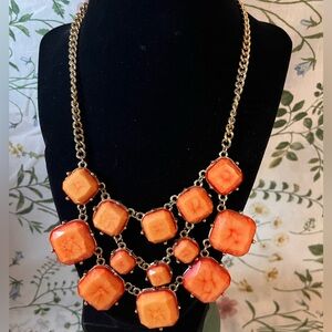 Corral and golden bib necklace